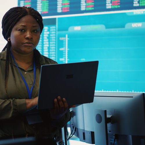 Business analyst looking into statistics and reports to detect any obstacles within the project structure, preparing solutions to ensure productivity. Manager studies numbers. Camera A.